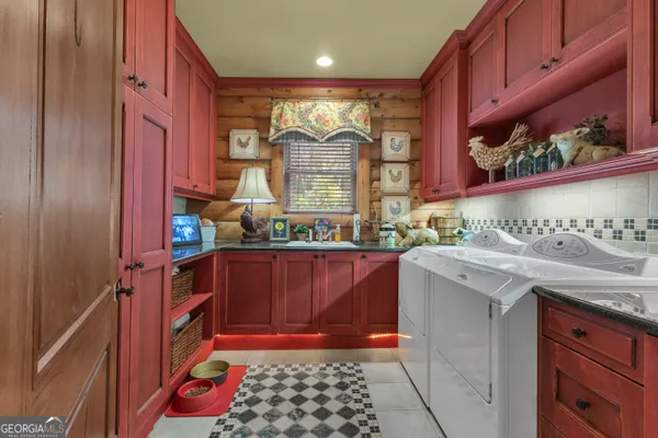 a bathroom with a toilet a sink a mirror and vanity