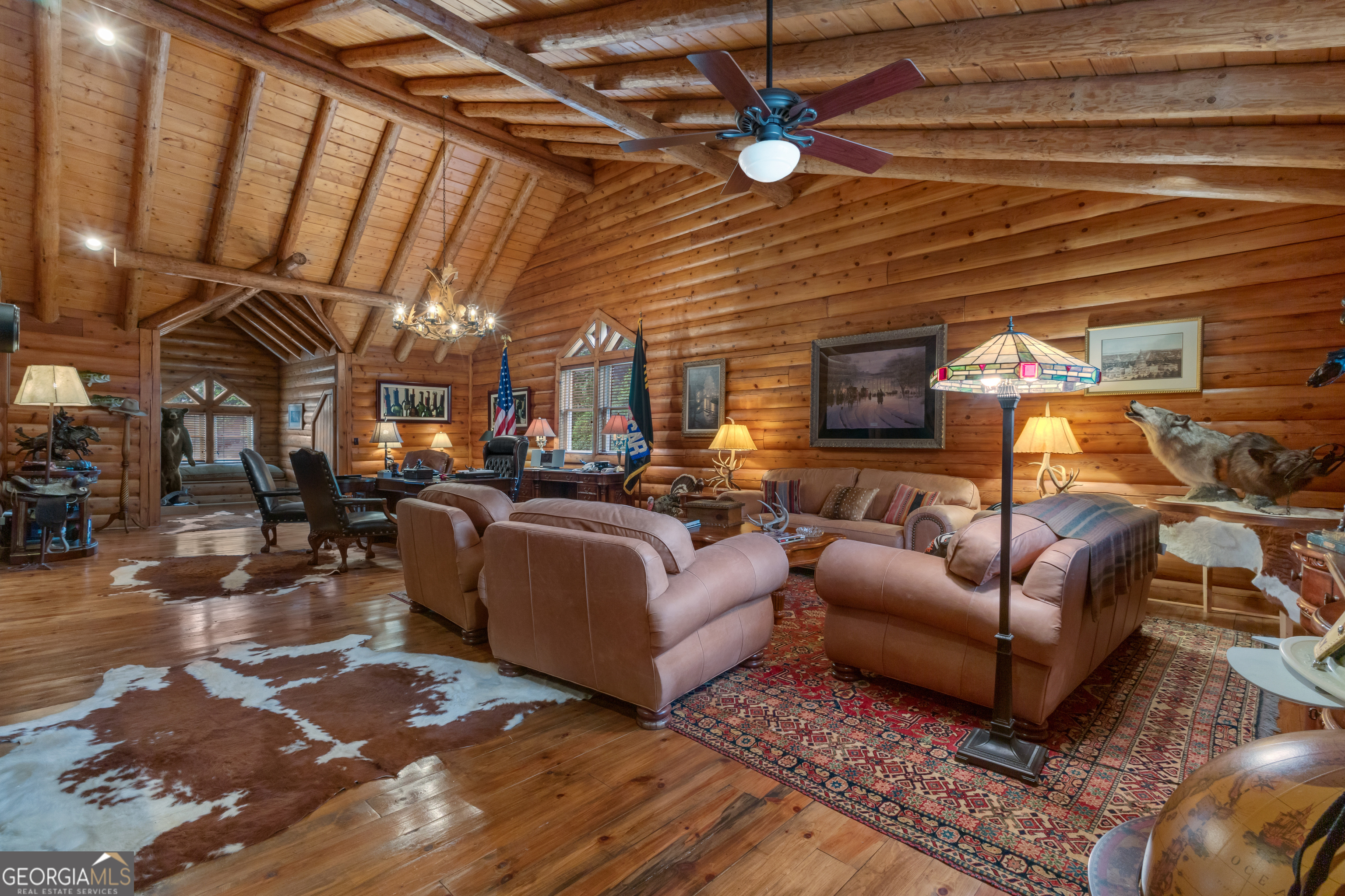 14803 Woolsey Road Hampton, GA 30228 - Photo 51 of 142 a living room with furniture a ceiling fan and a rug