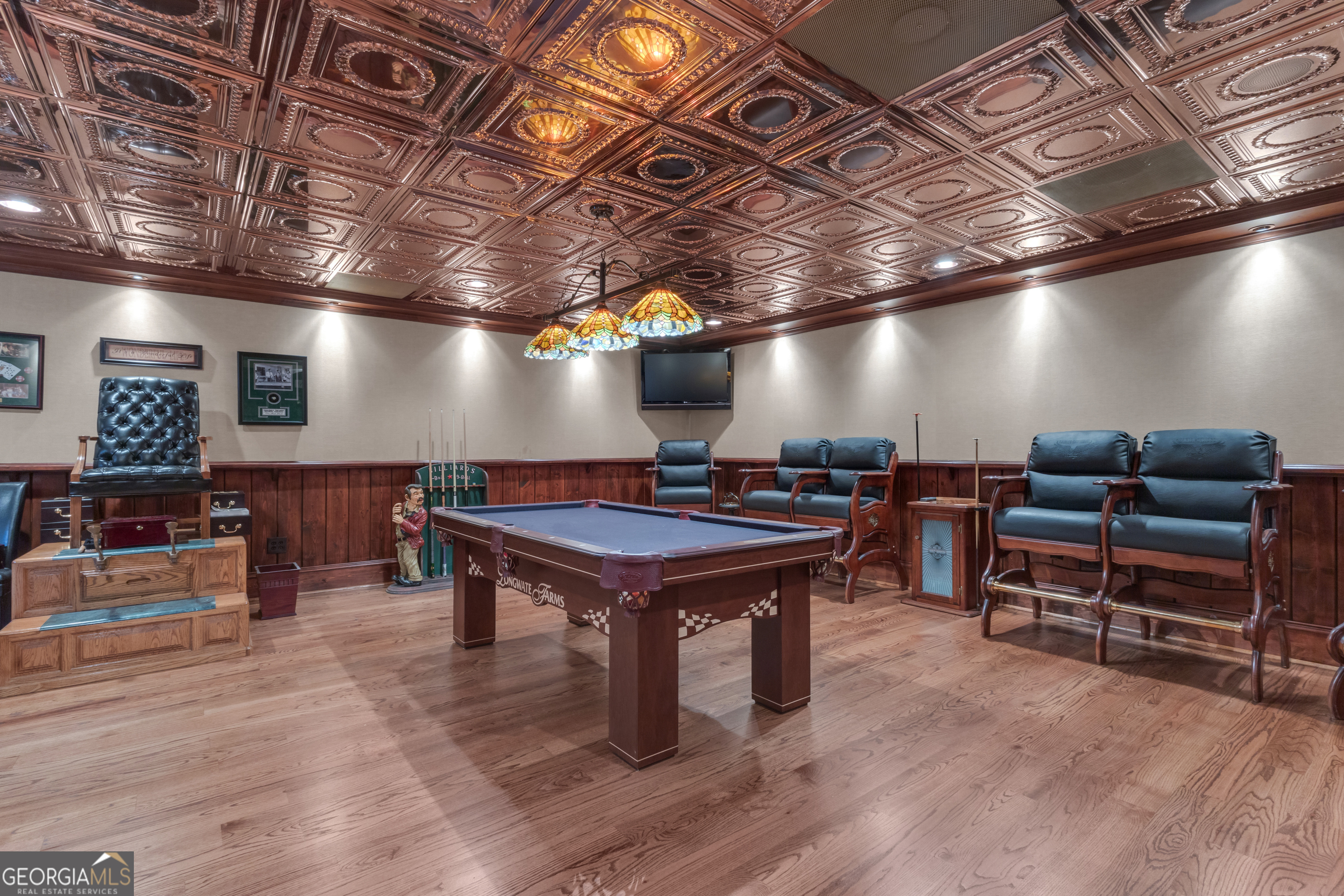 14803 Woolsey Road Hampton, GA 30228 - Photo 65 of 142 a room with furniture gym equipment wooden floor and a rug