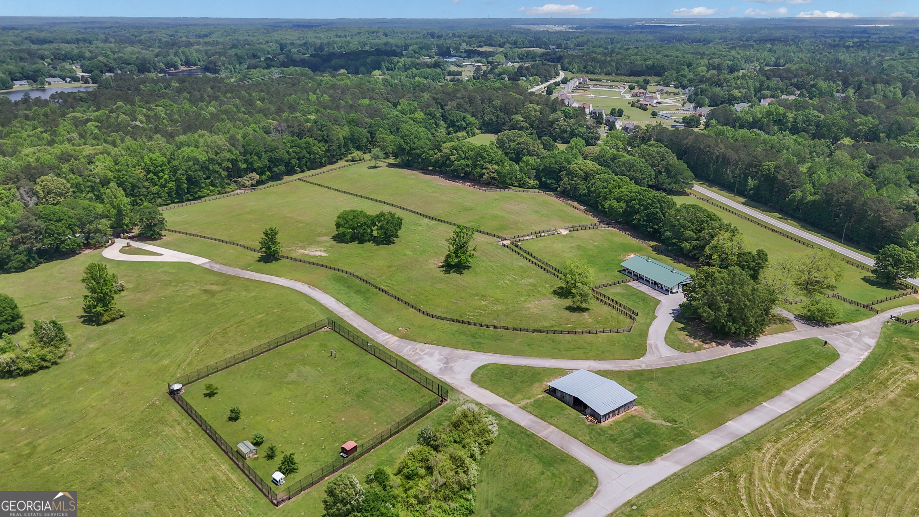14803 Woolsey Road Hampton, GA 30228 - Photo 7 of 142 an aerial view of a pool