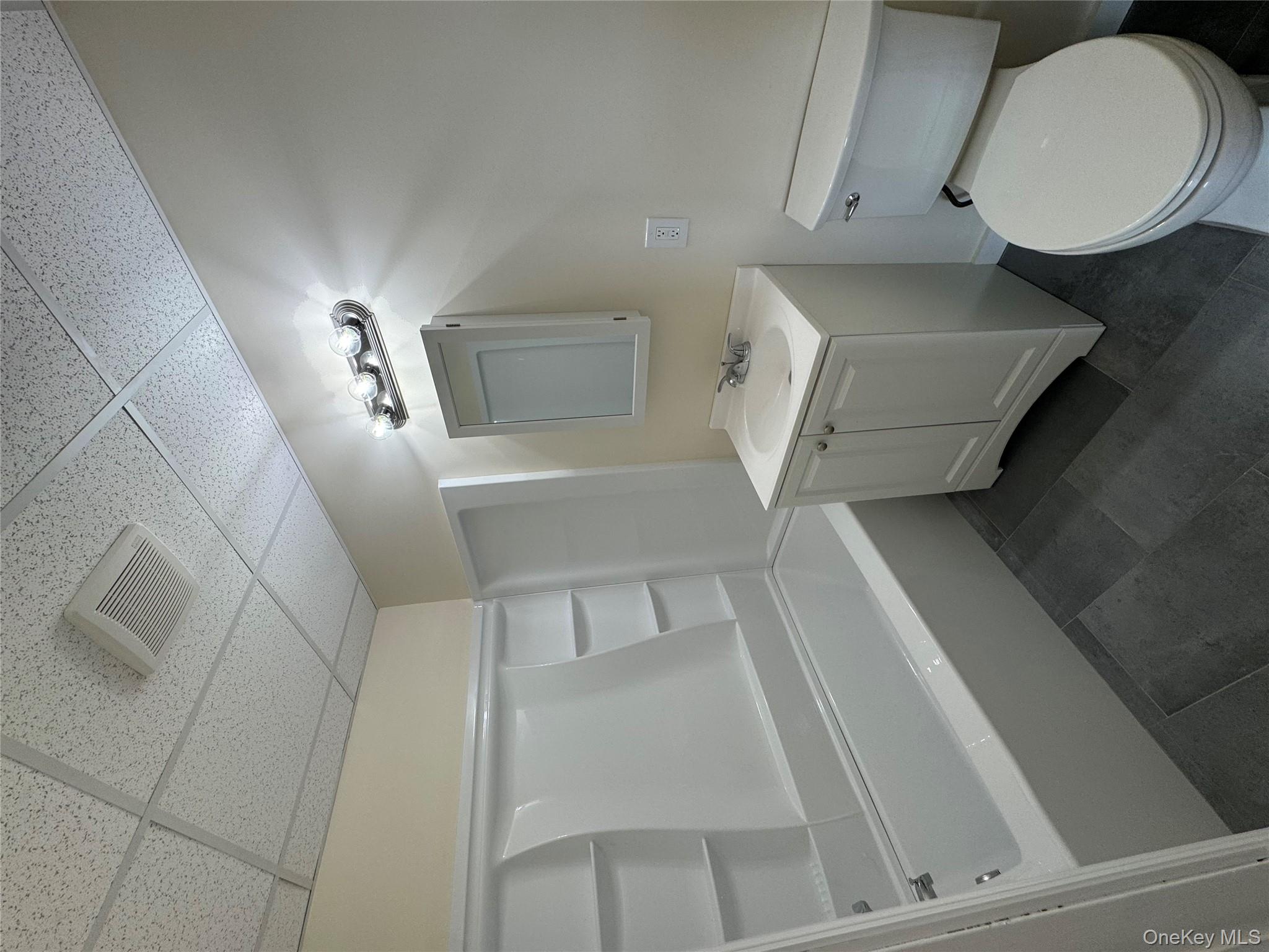 2 A Somerset Avenue East Islip, NY 11730 - Photo 2 of 6 a bathroom with a sink a toilet and shower