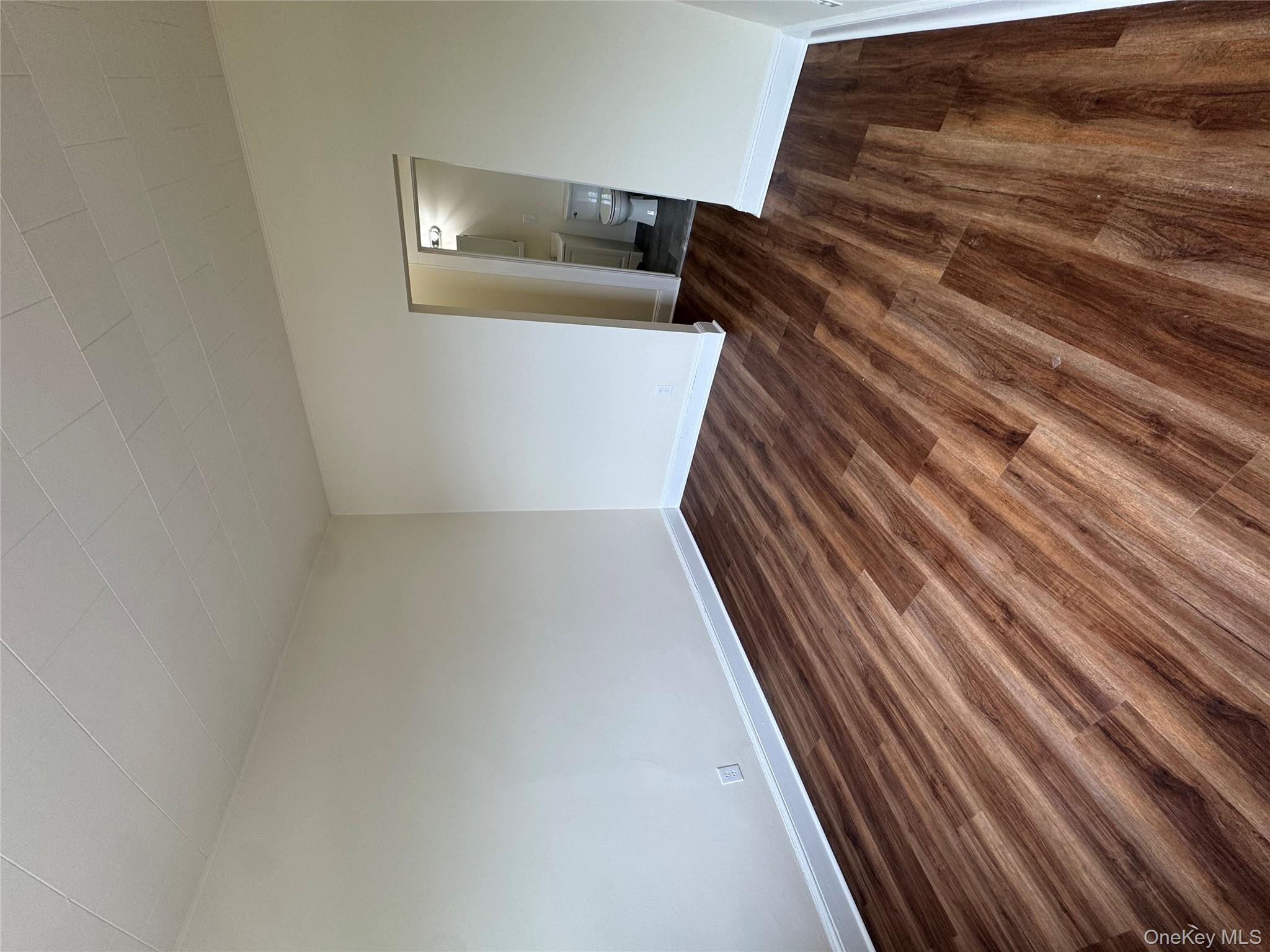 2 A Somerset Avenue East Islip, NY 11730 - Photo 3 of 6 a view of empty room with wooden floor