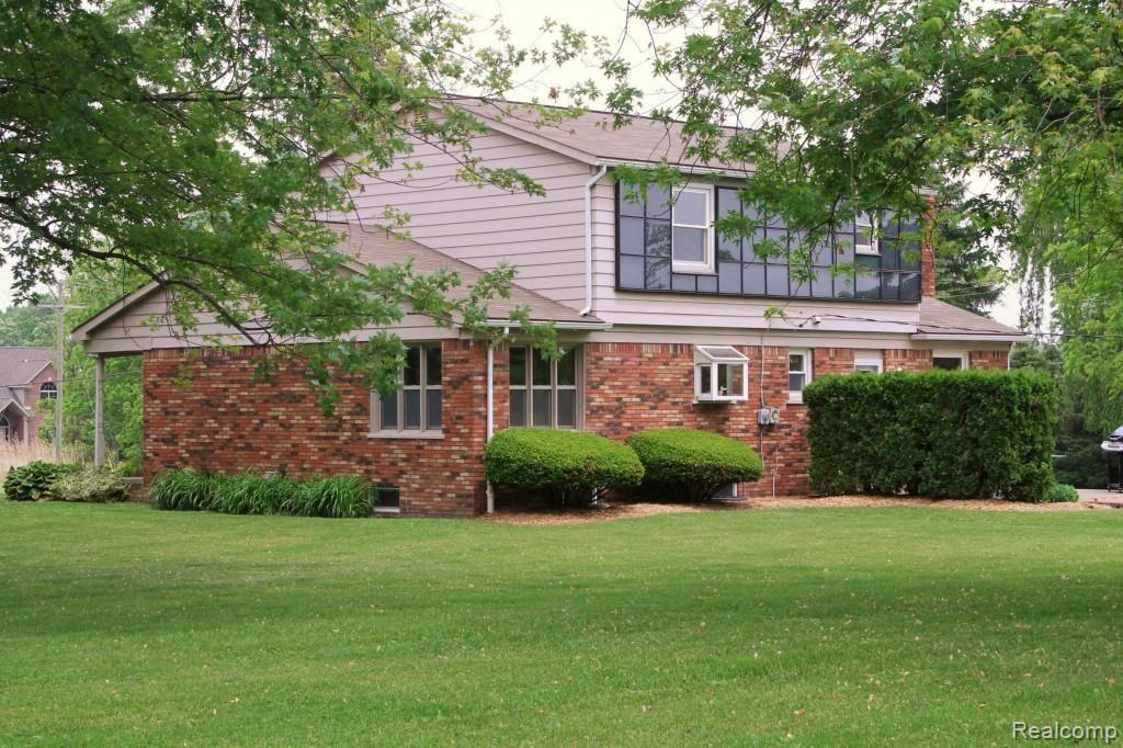 6544 General Squier Road Almont, MI 48003 - Photo 8 of 53 Back side of home. Nicely groomed yard and landscaping!