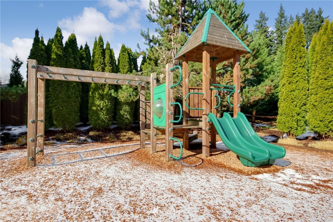 21809 38th Drive Southeast Bothell, WA 98021 - Photo 27 of 27 a view of a chair and table in backyard
