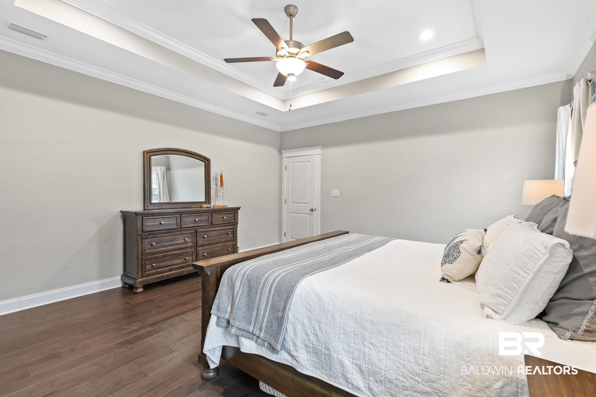 13233 Ibis Boulevard Daphne, AL 36527 - Photo 27 of 100 Bedroom featuring a tray ceiling with crown molding, recessed lighting, and a ceiling fan