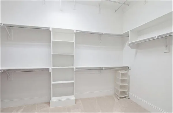 a view of an empty walk in closet