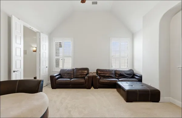 a living room with furniture and a couch