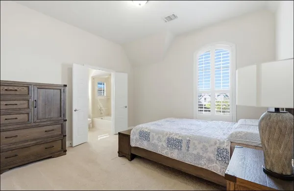 a bedroom with a bed and furniture