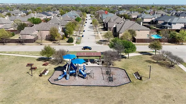 an aerial view of a house with a swimming pool patio and mountain view