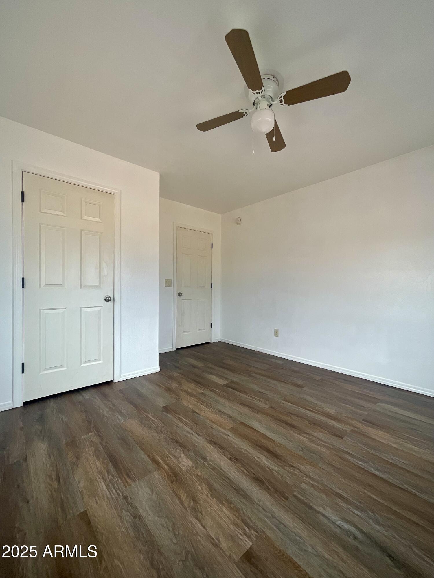 242 County Road Concho, AZ 85924 - Photo 11 of 63 wooden floor in an empty room