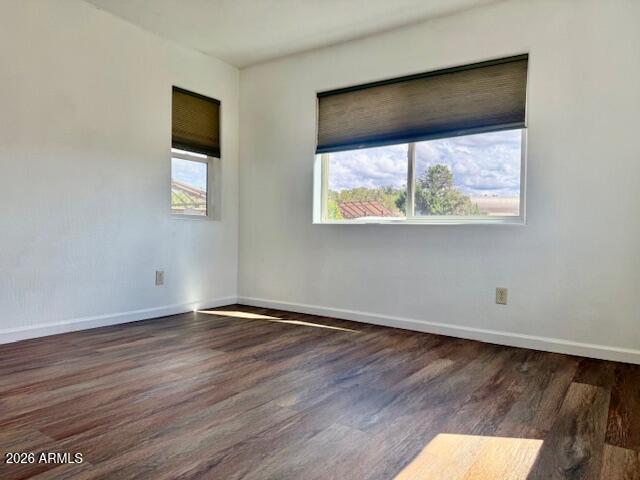 242 County Road Concho, AZ 85924 - Photo 22 of 63 a view of an empty room with wooden floor and a window