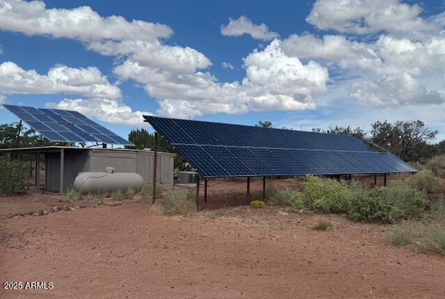 242 County Road Concho, AZ 85924 - Photo 30 of 63 a backyard of a house with table and chairs