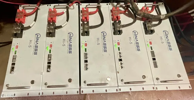 a bathroom with a granite countertop and white sink