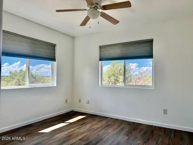 242 County Road Concho, AZ 85924 - Photo 8 of 63 a view of an empty room with wooden floor and a window