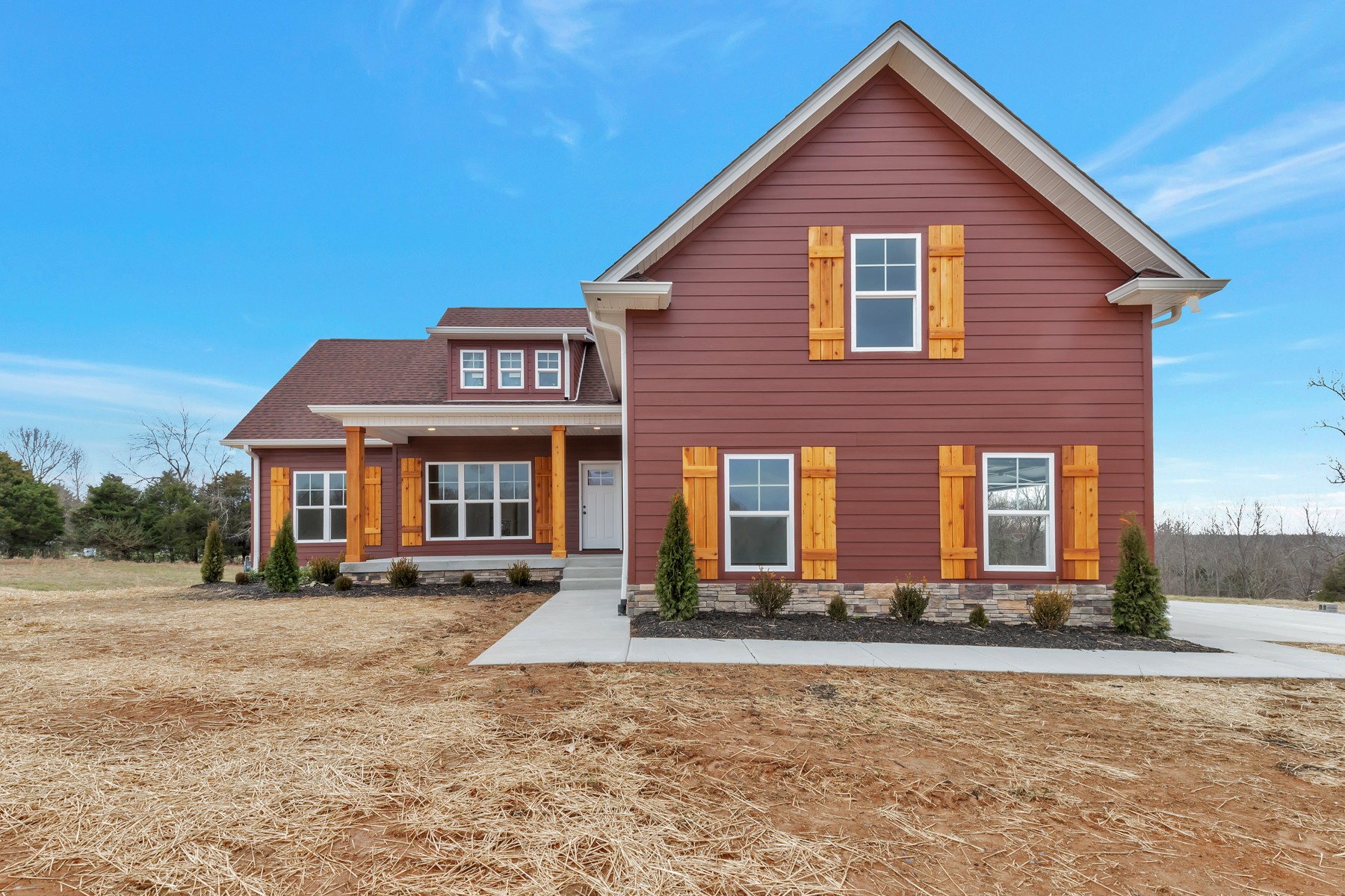 a front view of a house with yard