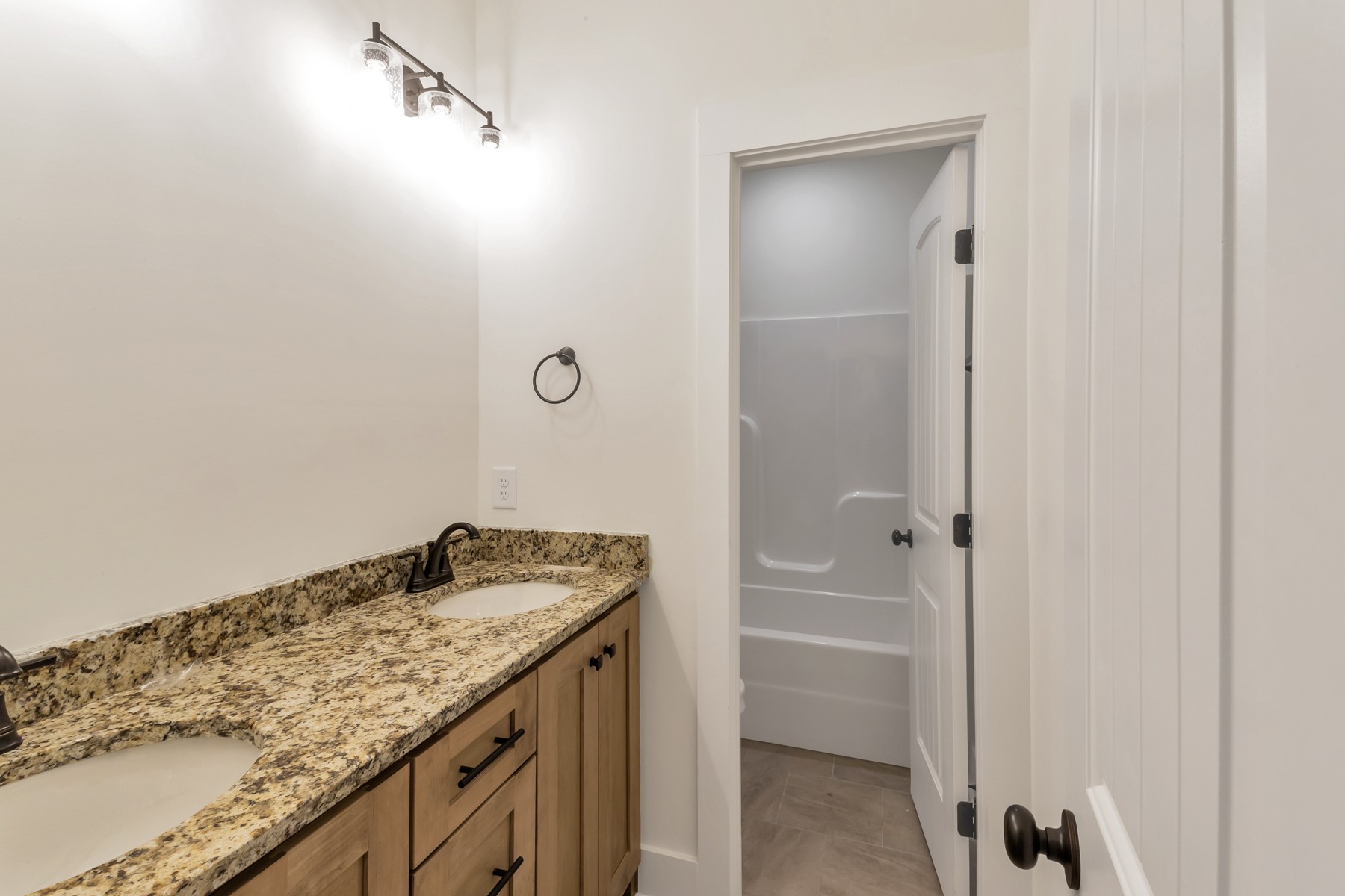3184 Battle Creek Road Springfield, TN 37172 - Photo 12 of 15 a bathroom with a granite countertop sink and a mirror