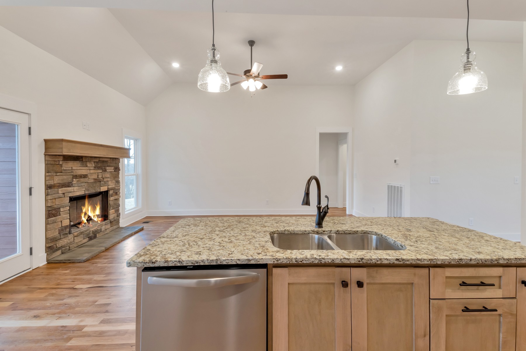3184 Battle Creek Road Springfield, TN 37172 - Photo 6 of 15 a kitchen with kitchen island a sink stainless steel appliances and chandelier