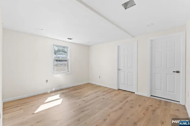 a view of a small space with wooden floor