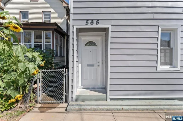 a view of a house with a door and a window