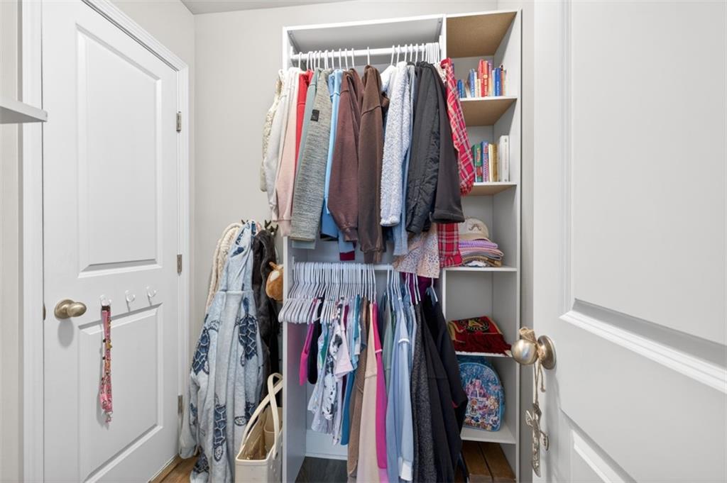 163 Hewett Road Pendergrass, GA 30567 - Photo 53 of 82 a view of walk in closet with clothes