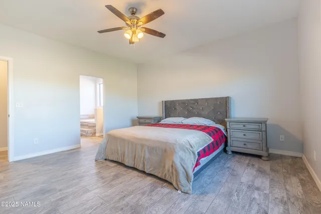 a bathroom with a granite countertop sink and a bathtub