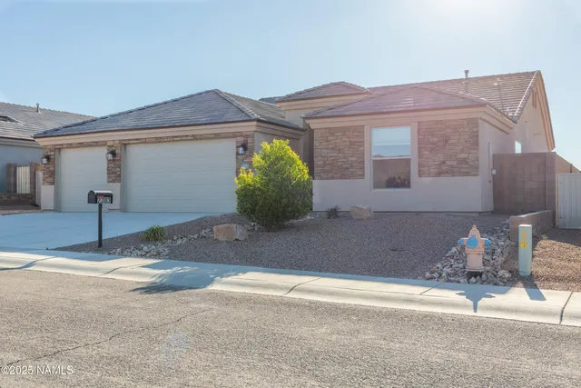 a view of a house with a outdoor space and a parking space