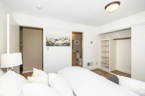 a bedroom with a bed and a cabinets