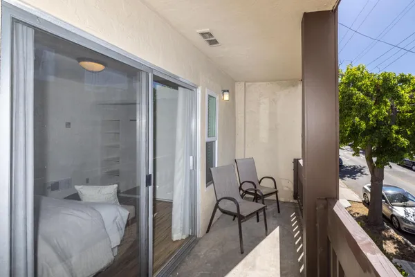 a bathroom with a glass door shower and a sink