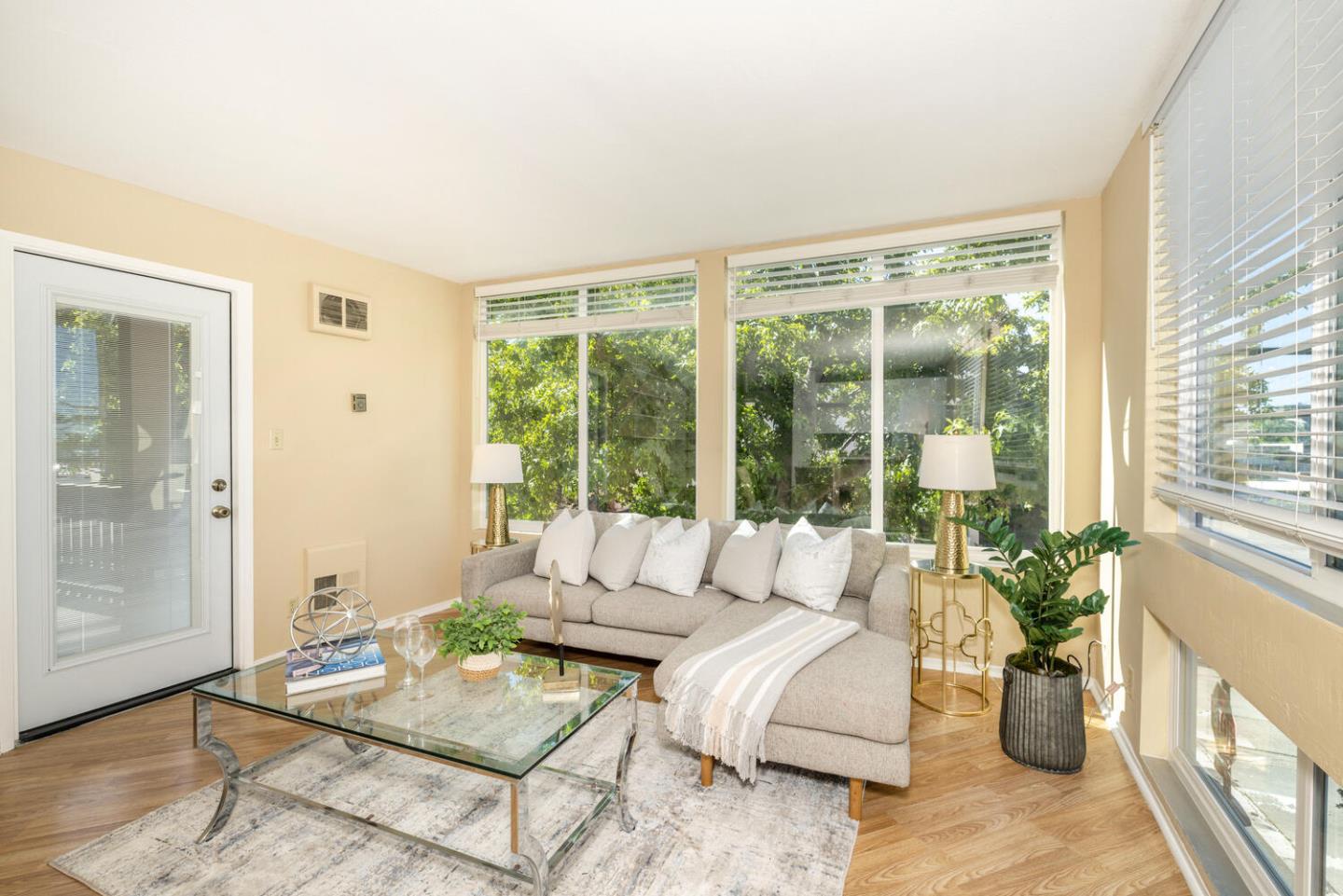 2201 Virginia Street, Unit 2 Berkeley, CA 94709 - Photo 8 of 24 a living room with furniture and floor to ceiling windows
