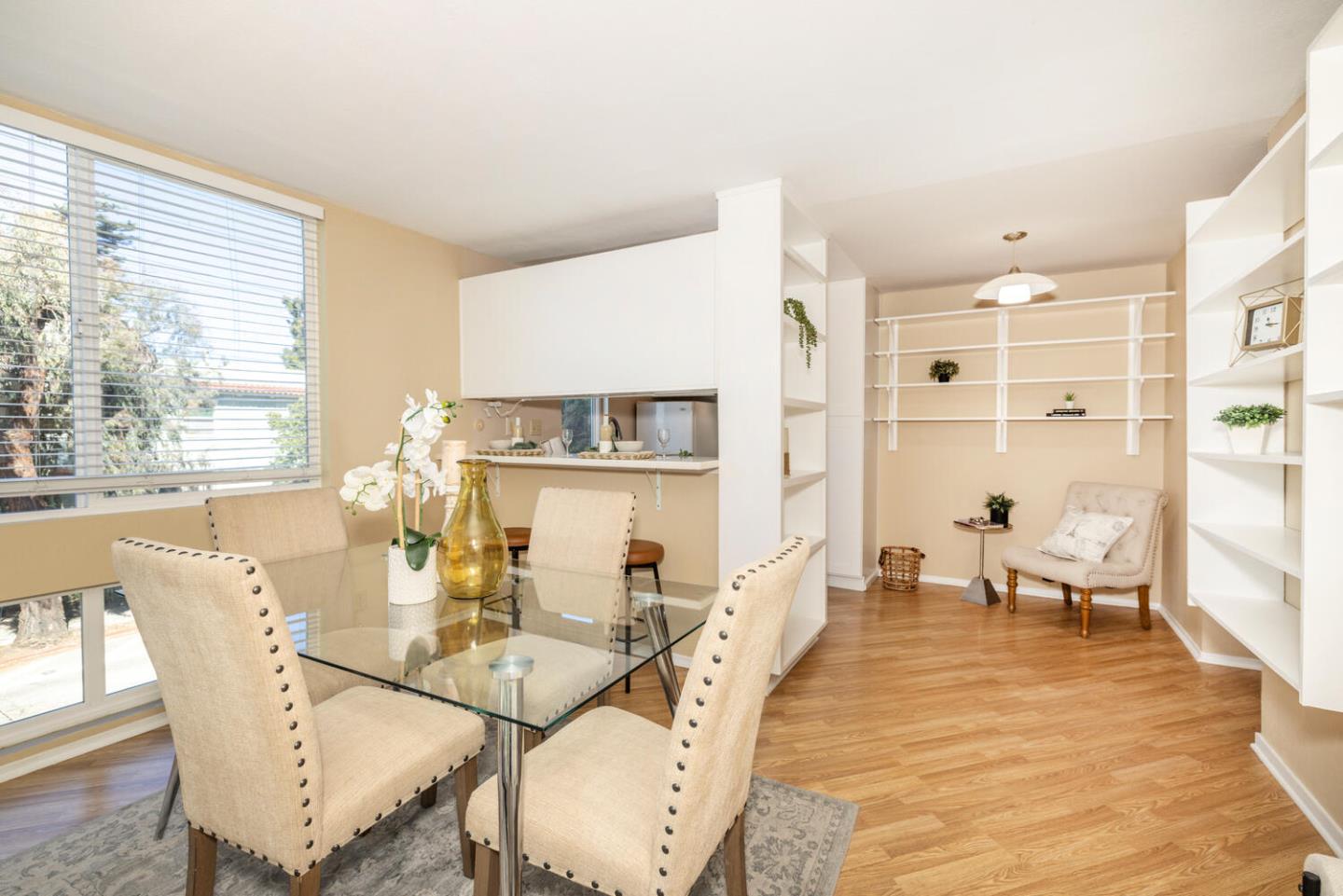 2201 Virginia Street, Unit 2 Berkeley, CA 94709 - Photo 10 of 24 a dining room with wooden floor and large windows