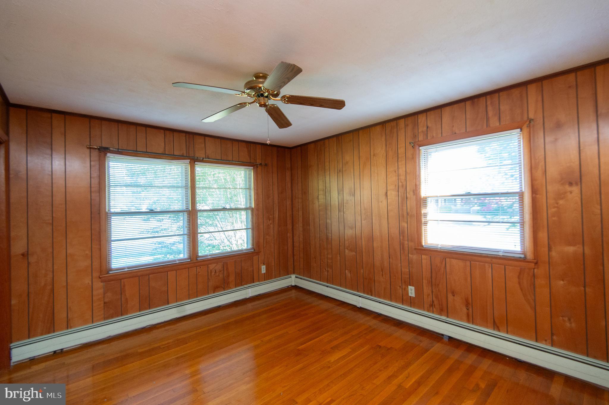 2 Algonquin Road Cambridge, MD 21613 - Photo 17 of 26 a view of an empty room with a window and wooden floor