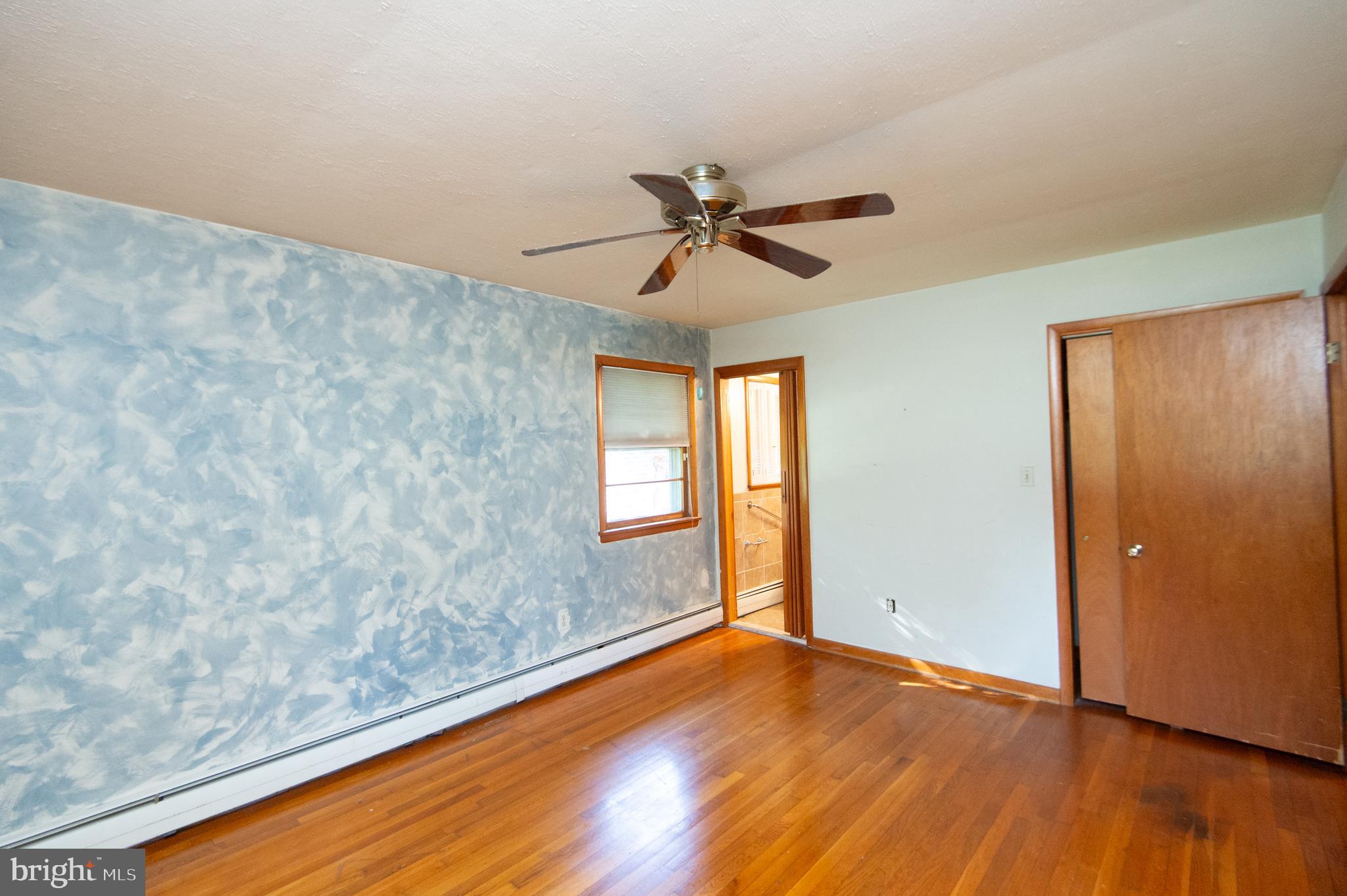 2 Algonquin Road Cambridge, MD 21613 - Photo 18 of 26 an empty room with wooden floor and windows