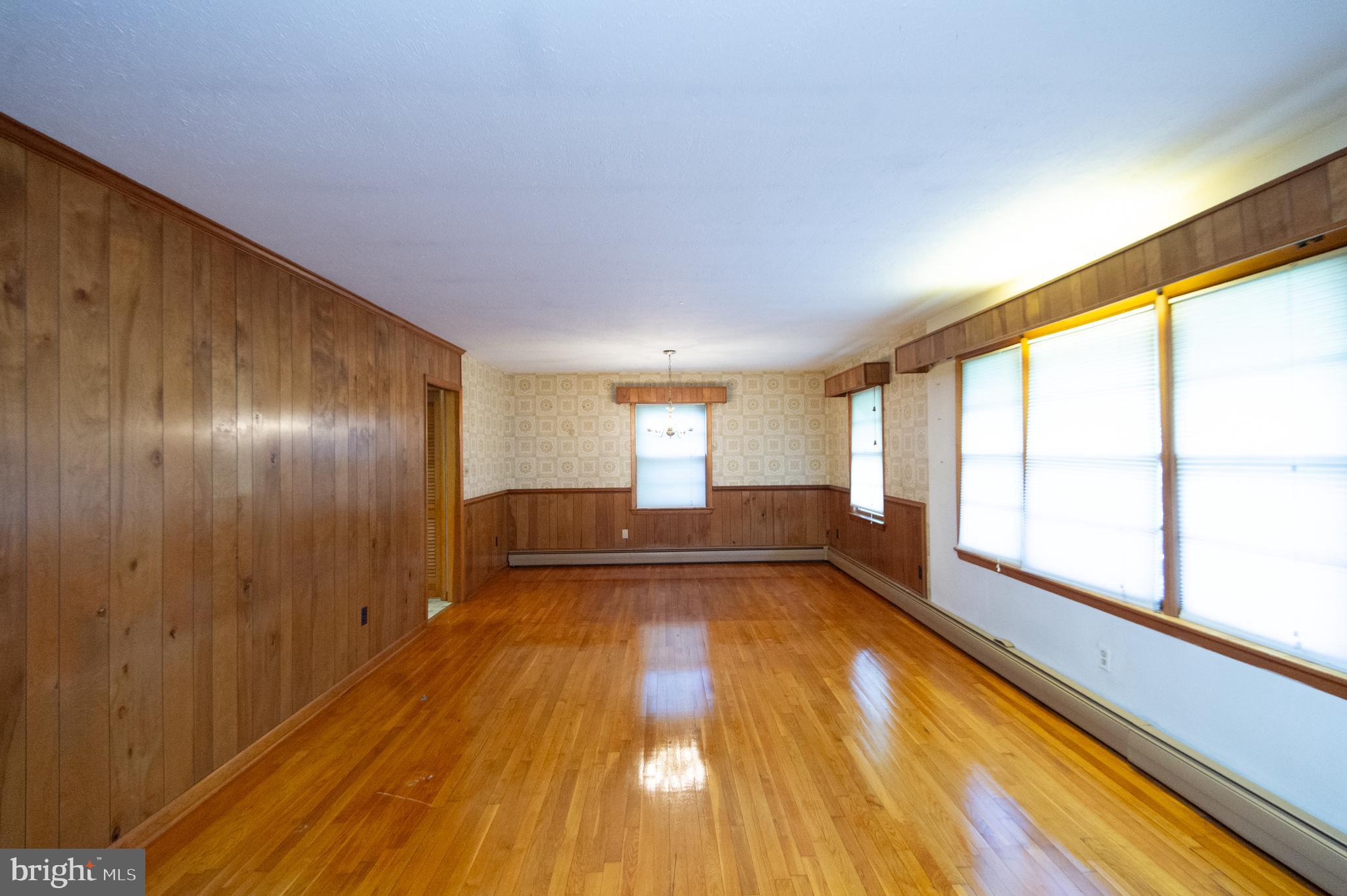 2 Algonquin Road Cambridge, MD 21613 - Photo 6 of 26 a view of empty room with wooden floor and fan