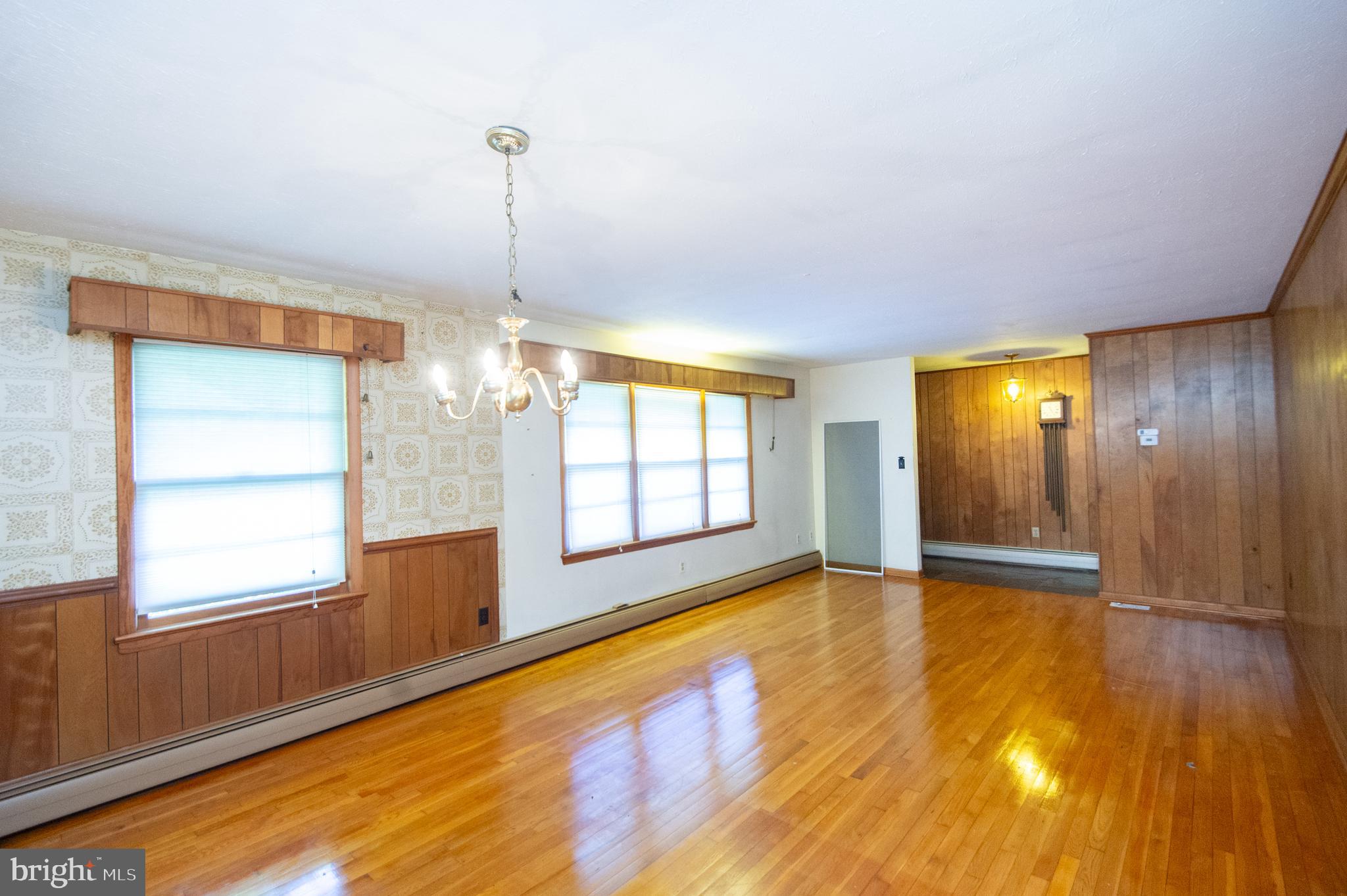 2 Algonquin Road Cambridge, MD 21613 - Photo 7 of 26 a view of an empty room with window and wooden floor