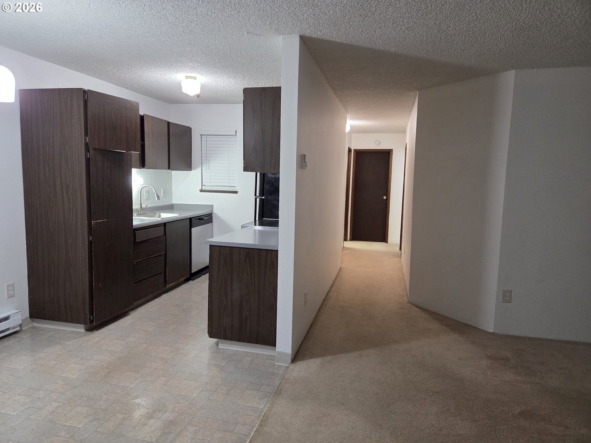 13397 Southwest 17th Street Beaverton, OR 97008 - Photo 22 of 31 a kitchen with stainless steel appliances a refrigerator and cabinets