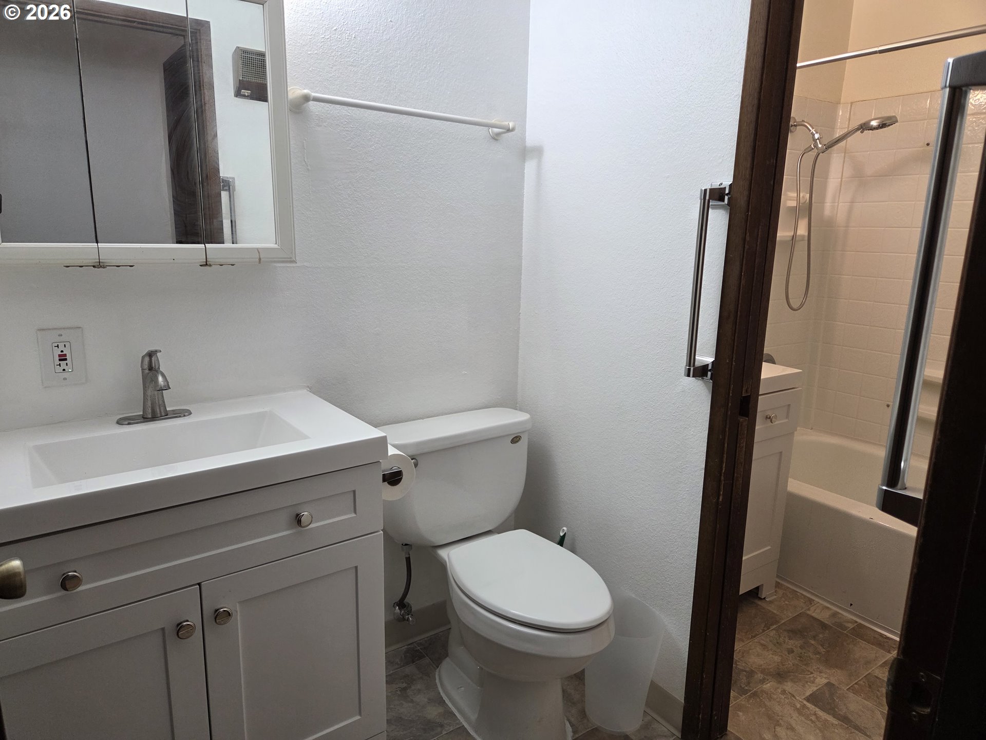 13397 Southwest 17th Street Beaverton, OR 97008 - Photo 25 of 31 a bathroom with a sink a toilet and shower