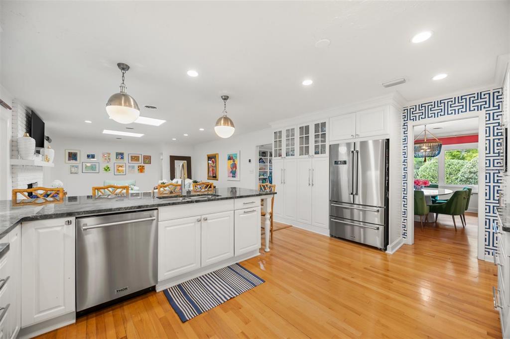 800 Juanita Rael Road Winter Park, FL 32789 - Photo 12 of 36 a kitchen with stainless steel appliances a refrigerator and a stove top oven