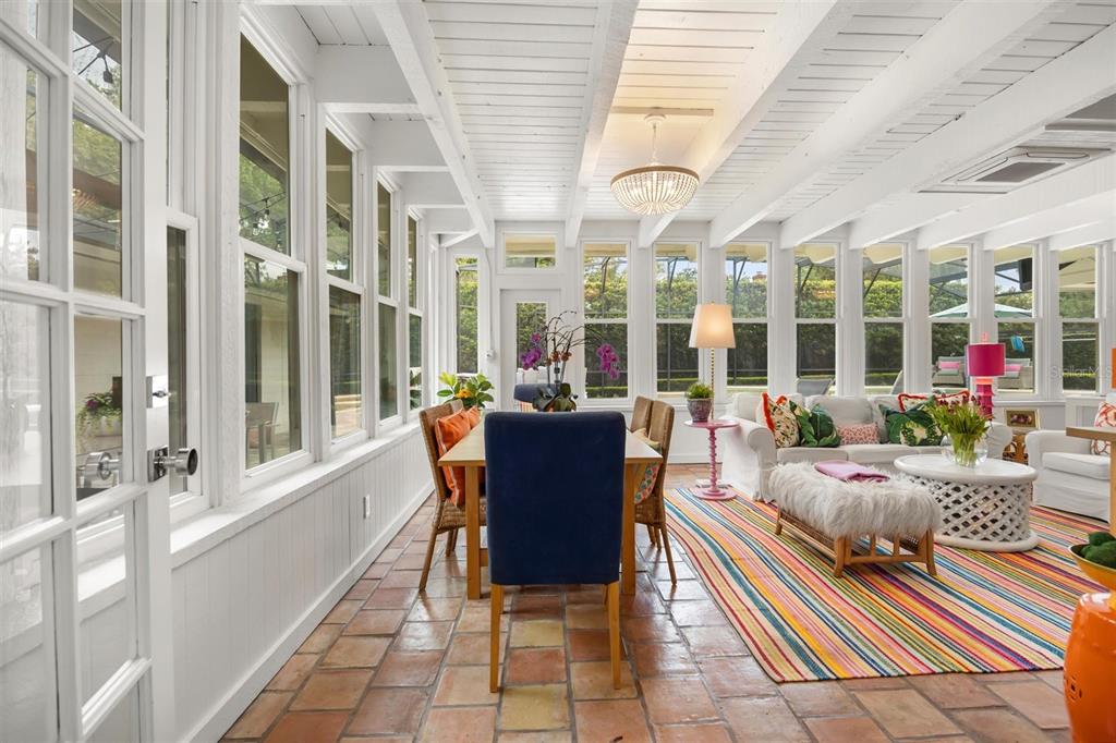 800 Juanita Rael Road Winter Park, FL 32789 - Photo 17 of 36 a living room with furniture and a floor to ceiling window