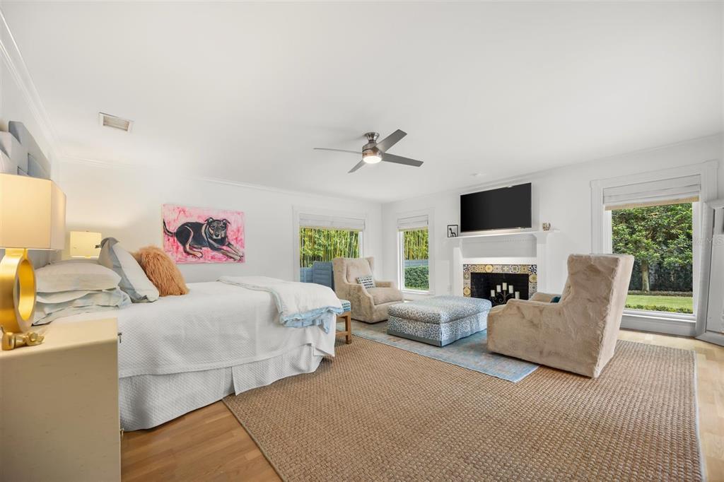 800 Juanita Rael Road Winter Park, FL 32789 - Photo 18 of 36 a bedroom with a bed and a fireplace