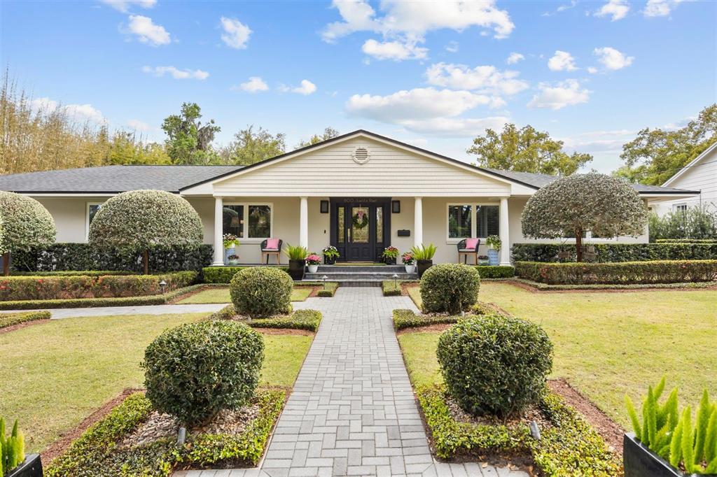 800 Juanita Rael Road Winter Park, FL 32789 - Photo 2 of 36 a front view of a house with swimming pool and furniture
