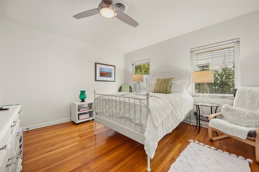 800 Juanita Rael Road Winter Park, FL 32789 - Photo 21 of 36 a bedroom with a bed and a chandelier