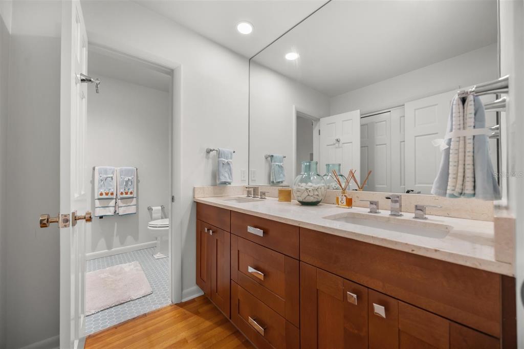 800 Juanita Rael Road Winter Park, FL 32789 - Photo 24 of 36 a bathroom with a granite countertop sink mirror and double
