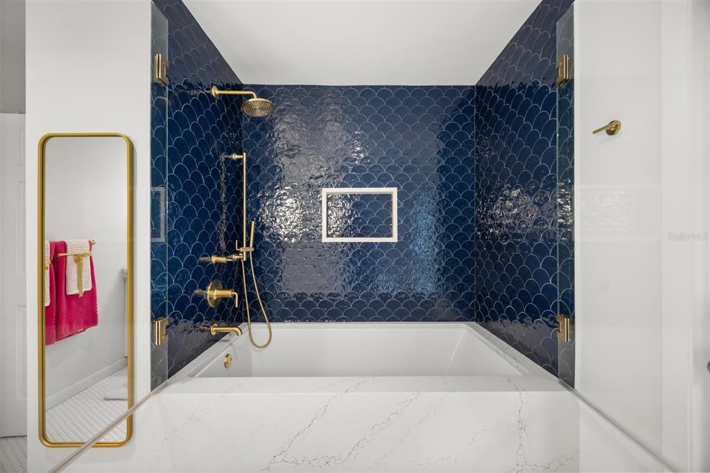 800 Juanita Rael Road Winter Park, FL 32789 - Photo 27 of 36 a bathroom with a bathtub and a shower