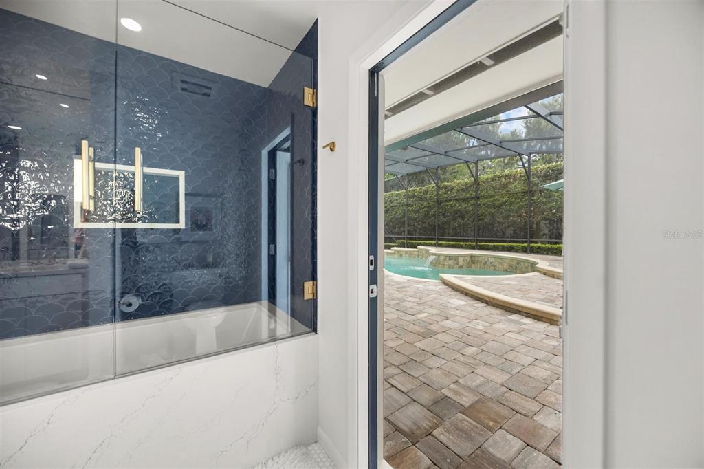 800 Juanita Rael Road Winter Park, FL 32789 - Photo 29 of 36 a bathroom with a bathtub and a shower