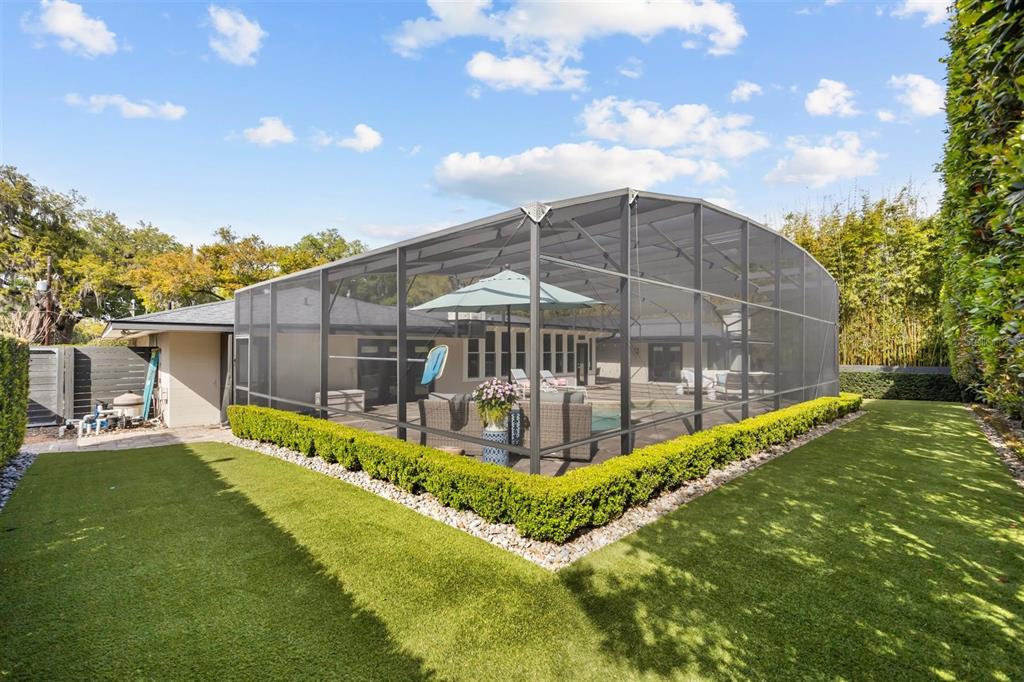 800 Juanita Rael Road Winter Park, FL 32789 - Photo 35 of 36 a view of a house with a yard