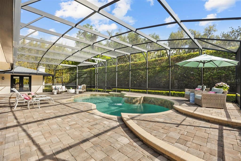 800 Juanita Rael Road Winter Park, FL 32789 - Photo 5 of 36 a view of a patio with a table and chairs