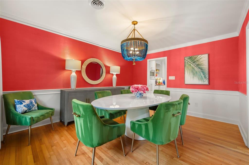 800 Juanita Rael Road Winter Park, FL 32789 - Photo 8 of 36 a view of a dining room with furniture and wooden floor