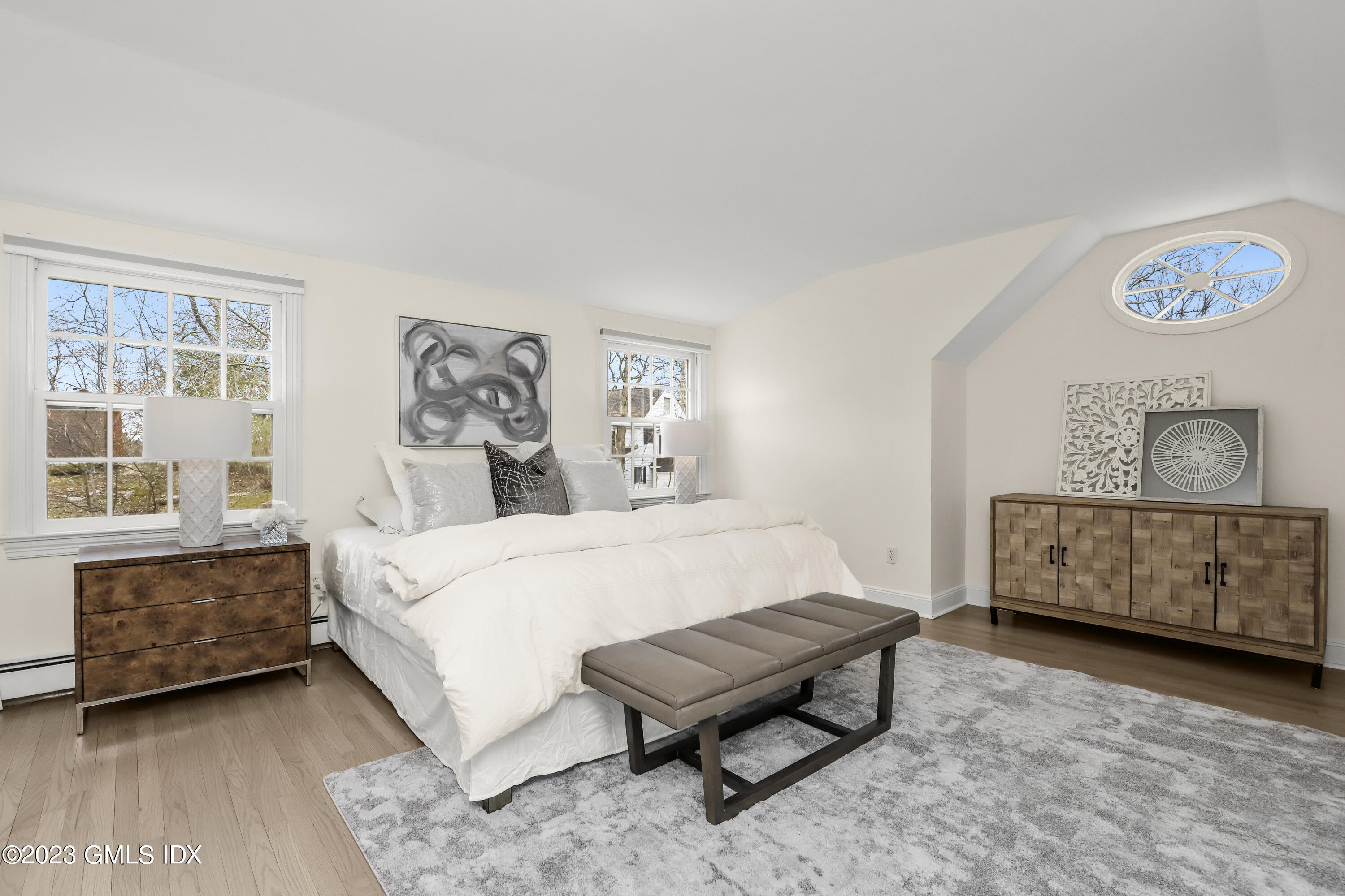 33 Bote Road Greenwich, CT 06830 - Photo 21 of 33 a spacious bedroom with a bed and a table in it