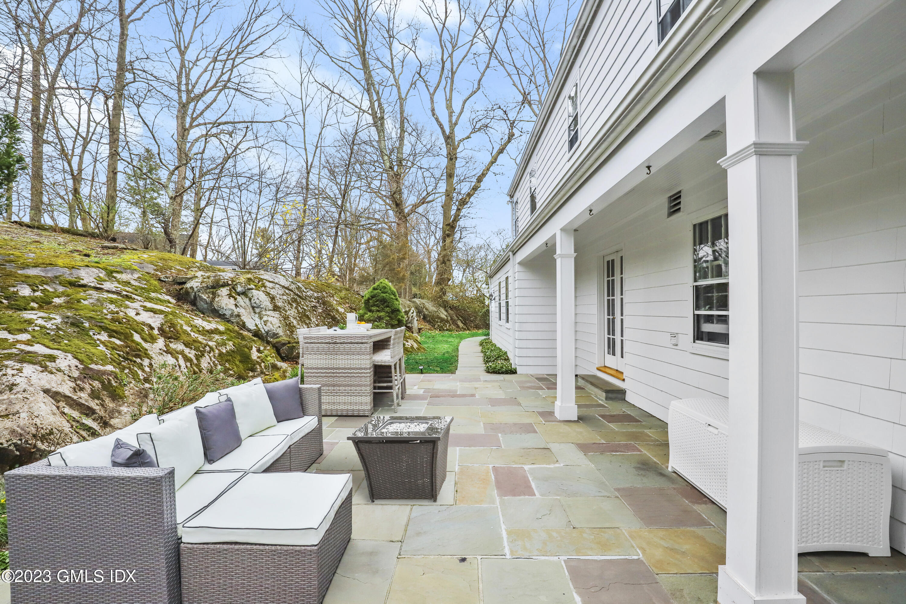 33 Bote Road Greenwich, CT 06830 - Photo 29 of 33 a view of a patio with couches and chairs with wooden fence