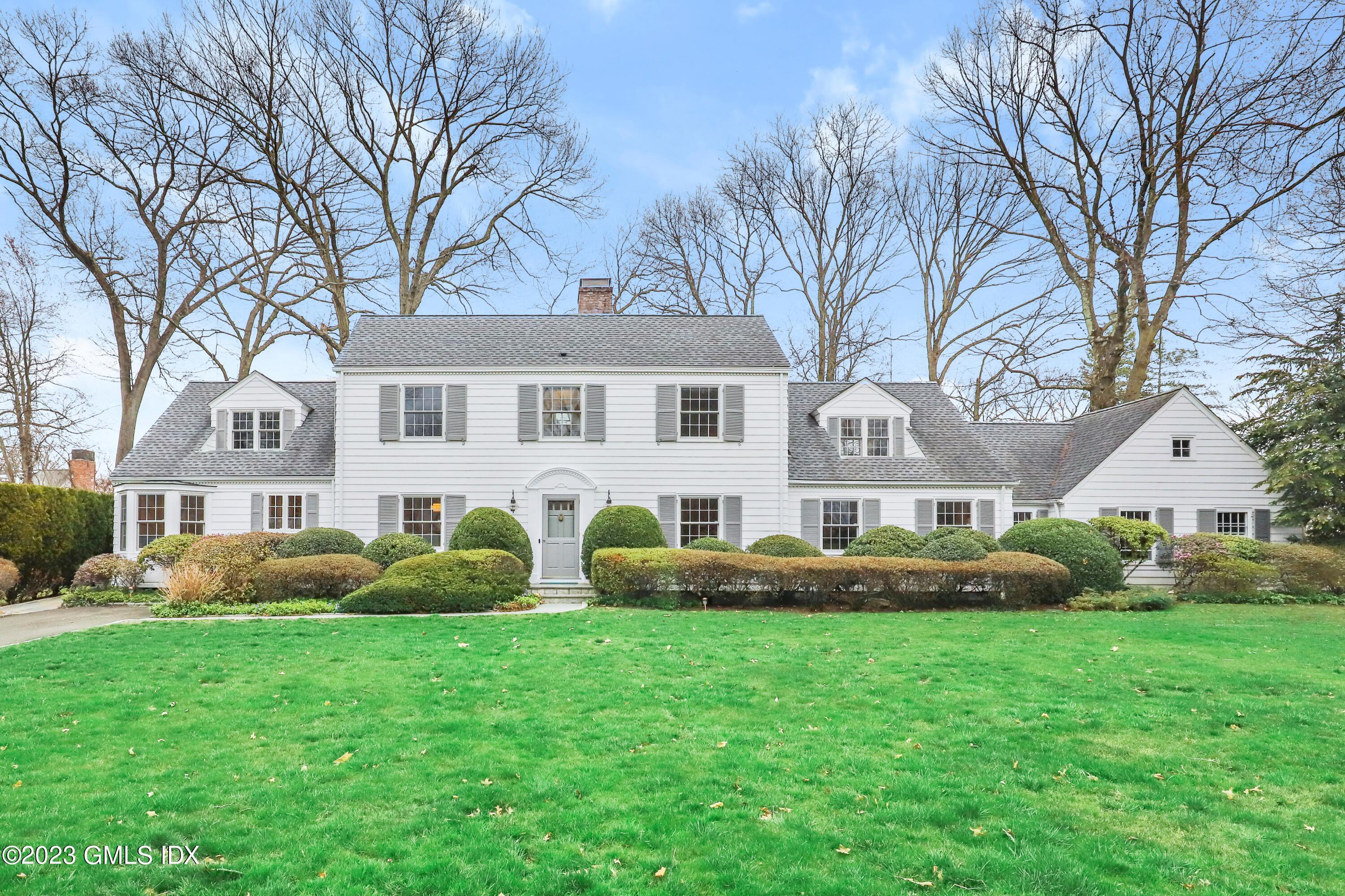 33 Bote Road Greenwich, CT 06830 - Photo 33 of 33 a front view of a house with garden and trees